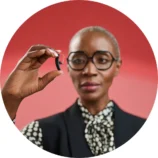 Styletto-IX_woman-holding-hearing-aid_circle_1000x1000